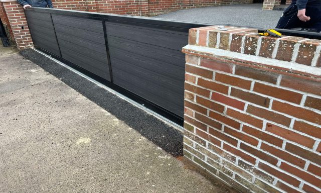 Automated gate with composite inserts